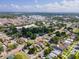 Aerial shot capturing the home nestled in a neighborhood with mature trees and beautiful landscapes at 630 48Th N Ave, St Petersburg, FL 33703