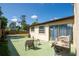 Charming backyard with a green patio area perfect for outdoor dining and relaxation at 630 48Th N Ave, St Petersburg, FL 33703