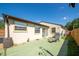 Backyard featuring a green patio, small lawn, and a grill, perfect for outdoor entertaining at 630 48Th N Ave, St Petersburg, FL 33703