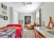 Bright bedroom with a car-shaped bed, Tampa Bay banner, and neutral walls at 630 48Th N Ave, St Petersburg, FL 33703