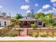 Charming single-story home with stone accents, fenced yard and mature landscaping at 630 48Th N Ave, St Petersburg, FL 33703