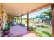 Inviting covered front porch with stone accents and comfortable outdoor seating at 630 48Th N Ave, St Petersburg, FL 33703