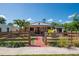 Charming single-story home with a well-manicured front yard and a decorative wooden fence at 630 48Th N Ave, St Petersburg, FL 33703