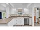Clean kitchen with ample storage space, laminate floor and natural light at 630 48Th N Ave, St Petersburg, FL 33703