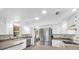 Modern kitchen featuring ample countertop space, stainless fridge and plenty of light at 630 48Th N Ave, St Petersburg, FL 33703