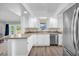 Well-lit kitchen with stainless steel appliances and laminate flooring at 630 48Th N Ave, St Petersburg, FL 33703