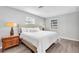 Calm main bedroom with light walls, wood floors, and a window bringing in natural lighting at 630 48Th N Ave, St Petersburg, FL 33703