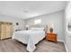 Tranquil main bedroom with neutral tones, wood floors, and natural light from a large window at 630 48Th N Ave, St Petersburg, FL 33703