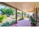 Covered front porch with outdoor seating provides a cozy and inviting entrance to the residence at 630 48Th N Ave, St Petersburg, FL 33703