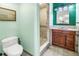 Bathroom features tiled walk-in shower, custom vanity, and modern fixtures at 6515 Dimarco Rd, Tampa, FL 33634