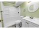 Compact bathroom with a shower, toilet, and sink with modern fixtures at 6515 Dimarco Rd, Tampa, FL 33634