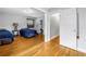 Spacious bedroom featuring hardwood floors, two beds and adjacent laundry at 6515 Dimarco Rd, Tampa, FL 33634