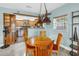 Bright dining area with a wooden table and a view into the well-equipped kitchen at 6515 Dimarco Rd, Tampa, FL 33634