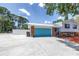 View of the property featuring a wide driveway leading to the home's garage at 6515 Dimarco Rd, Tampa, FL 33634
