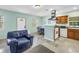 Bright kitchen area with stainless steel appliances, tile floors, and blue accent walls at 6515 Dimarco Rd, Tampa, FL 33634