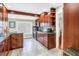 Well-equipped kitchen with stainless steel appliances, wood cabinets, and granite countertops at 6515 Dimarco Rd, Tampa, FL 33634