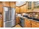 Well-appointed kitchen with stainless steel appliances, granite countertops, and wooden cabinetry at 6515 Dimarco Rd, Tampa, FL 33634