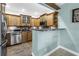 Modern kitchen features wooden cabinets, stainless steel appliances, and stylish countertops at 6515 Dimarco Rd, Tampa, FL 33634