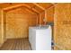 Interior shed view with wooden walls featuring modern washer and dryer units at 6515 Dimarco Rd, Tampa, FL 33634