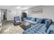 Relaxing living room featuring a plush couch and decorative tiling at 6515 Dimarco Rd, Tampa, FL 33634