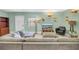 Bright living room with a large gray sectional sofa and lots of natural light at 6515 Dimarco Rd, Tampa, FL 33634