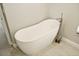 Bathroom featuring a freestanding tub, tile floor, and nickel faucet at 6994 Country Lakes Cir, Sarasota, FL 34243