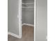Walk in closet with tile floors, wire shelving, and neutral paint at 6994 Country Lakes Cir, Sarasota, FL 34243