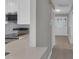 Elegant entryway featuring a decorative front door, light grey walls, and wood flooring at 6994 Country Lakes Cir, Sarasota, FL 34243