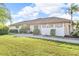 Spacious yard and manicured landscaping complement this single-Gathering home's exterior at 6994 Country Lakes Cir, Sarasota, FL 34243