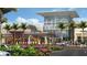 Contemporary design of University Town Center, featuring modern architecture, lush landscaping, and ample parking at 6994 Country Lakes Cir, Sarasota, FL 34243