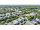 Expansive aerial view of the neighborhood, showcasing lush greenery, nearby ocean and the surrounding community at 7508 S Mascotte St, Tampa, FL 33616