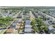 Wide aerial view of the community showcasing lush greenery, tidy streets, and a mix of housing styles at 7508 S Mascotte St, Tampa, FL 33616