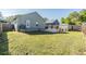 Spacious backyard with privacy fence and a detached storage shed, great for outdoor living and activities at 7508 S Mascotte St, Tampa, FL 33616