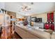 Inviting living room featuring hardwood floors, vaulted ceilings, and ample natural light at 7508 S Mascotte St, Tampa, FL 33616