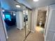 View from the hall with an enclosed closet and showing the bathroom at 880 Mandalay Ave # S511, Clearwater Beach, FL 33767