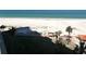 Expansive beach view showcasing the sand, ocean, and palm trees at 880 Mandalay Ave # S511, Clearwater Beach, FL 33767