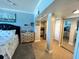 Cozy bedroom with stylish decor, tiled floors and a glimpse of the kitchen at 880 Mandalay Ave # S511, Clearwater Beach, FL 33767