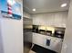Bright kitchen featuring stainless steel appliances and ample cabinet space at 880 Mandalay Ave # S511, Clearwater Beach, FL 33767