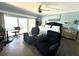 Bright main bedroom with king bed, ceiling fan, and sliding glass doors leading to ocean view balcony at 880 Mandalay Ave # S511, Clearwater Beach, FL 33767