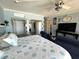 Bright main bedroom with king bed and seating area with view looking through doorway at 880 Mandalay Ave # S511, Clearwater Beach, FL 33767