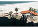 Overhead pool view with trees nearby at 880 Mandalay Ave # S511, Clearwater Beach, FL 33767