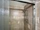 Shower features beautiful tiling, a shower caddy, and a modern shower head at 880 Mandalay Ave # S511, Clearwater Beach, FL 33767