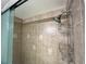 Shower features beautiful tiling, a shower caddy, and a modern shower head at 880 Mandalay Ave # S511, Clearwater Beach, FL 33767