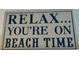 Relax, You're On Beach Time sign at 880 Mandalay Ave # S511, Clearwater Beach, FL 33767