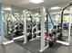 Fully-equipped weight room with modern machines and mirrors, designed for strength training and overall wellness at 880 Mandalay Ave # S511, Clearwater Beach, FL 33767