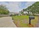 Well maintained home with a manicured lawn and mature trees at 8805 Van Fleet Rd, Riverview, FL 33578