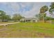 Charming home with a well-maintained lawn and mature palm tree at 8805 Van Fleet Rd, Riverview, FL 33578