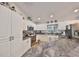 Updated kitchen features stainless steel appliances, dark granite countertops, and bright white cabinetry at 8805 Van Fleet Rd, Riverview, FL 33578