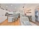 Bright, updated kitchen with island seating and stainless steel appliances and adjacent dining area at 8805 Van Fleet Rd, Riverview, FL 33578
