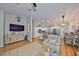 Bright living room with open floor plan, flowing into the kitchen at 8805 Van Fleet Rd, Riverview, FL 33578